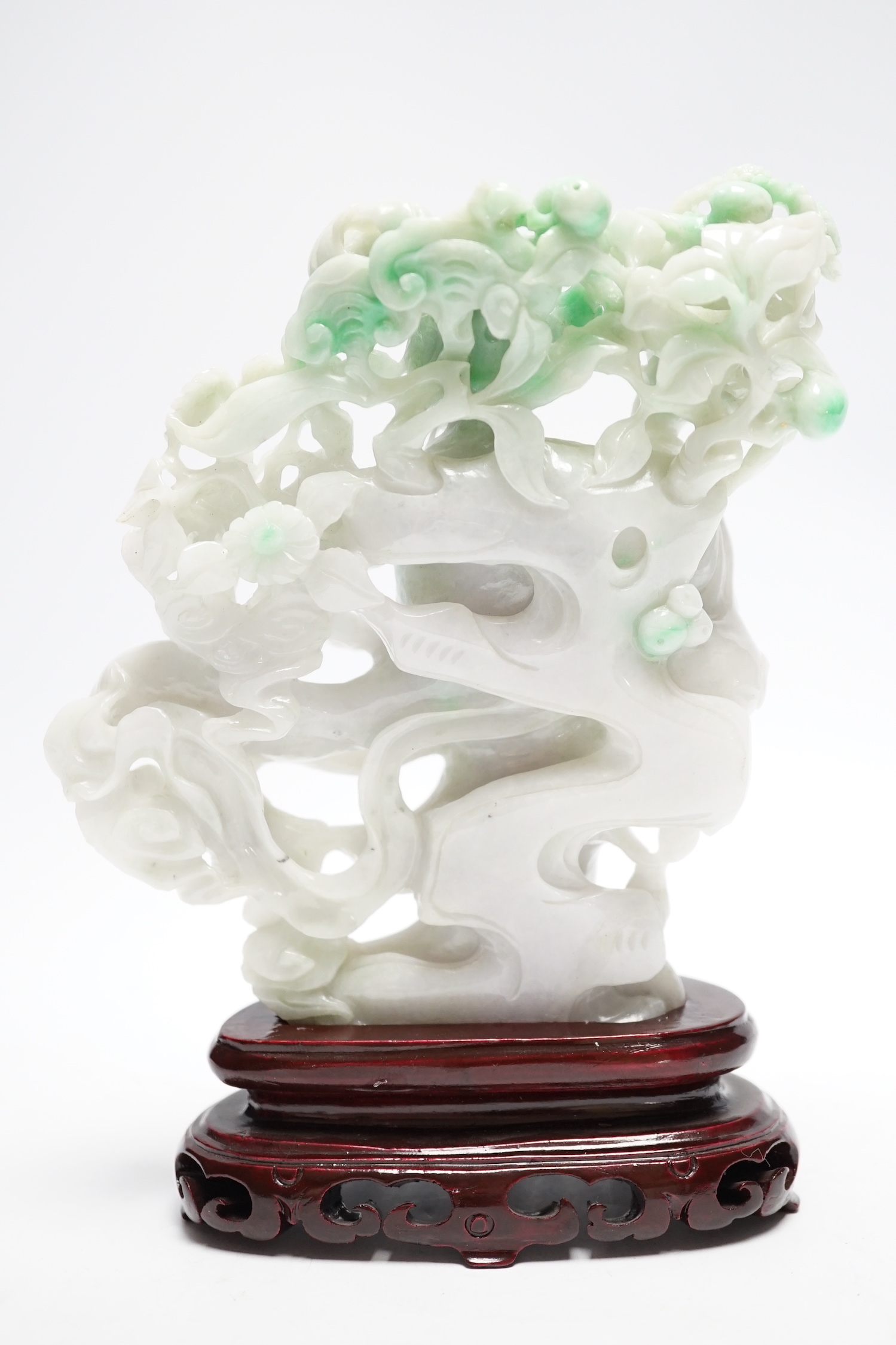 A Chinese jadeite figure of He Xiangu on carved stand, 17cm high